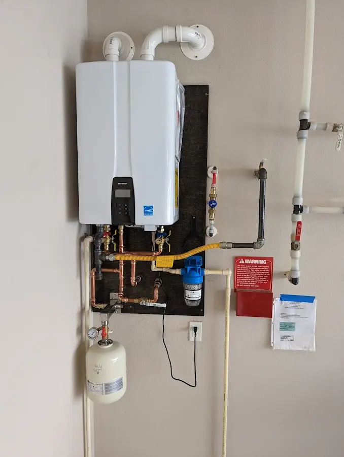 Professional plumber installing copper piping in a Wright City home